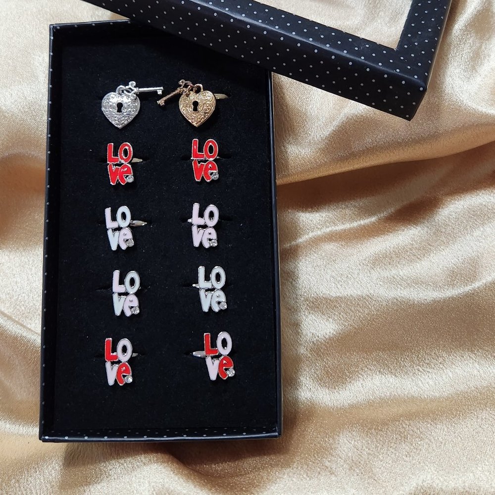 Starlet Shimmer mixed rings in box by Paparazzi